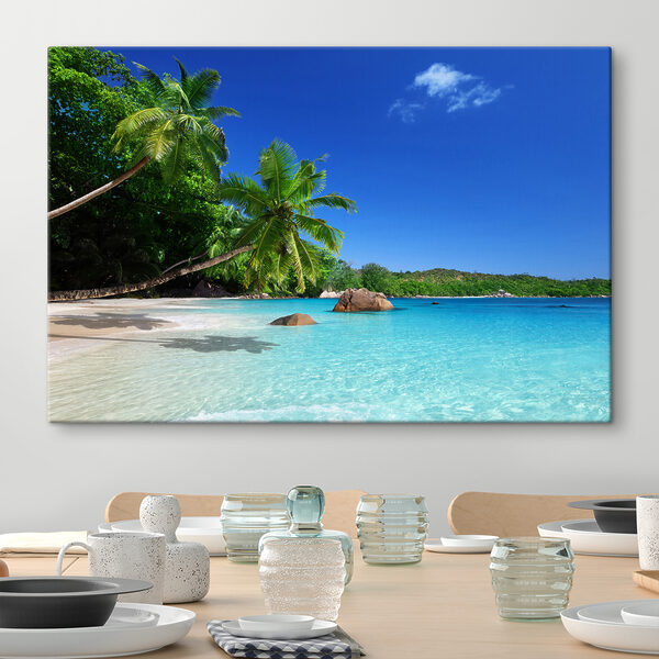 A beach with palm trees and blue water A beach with palm trees and blue water