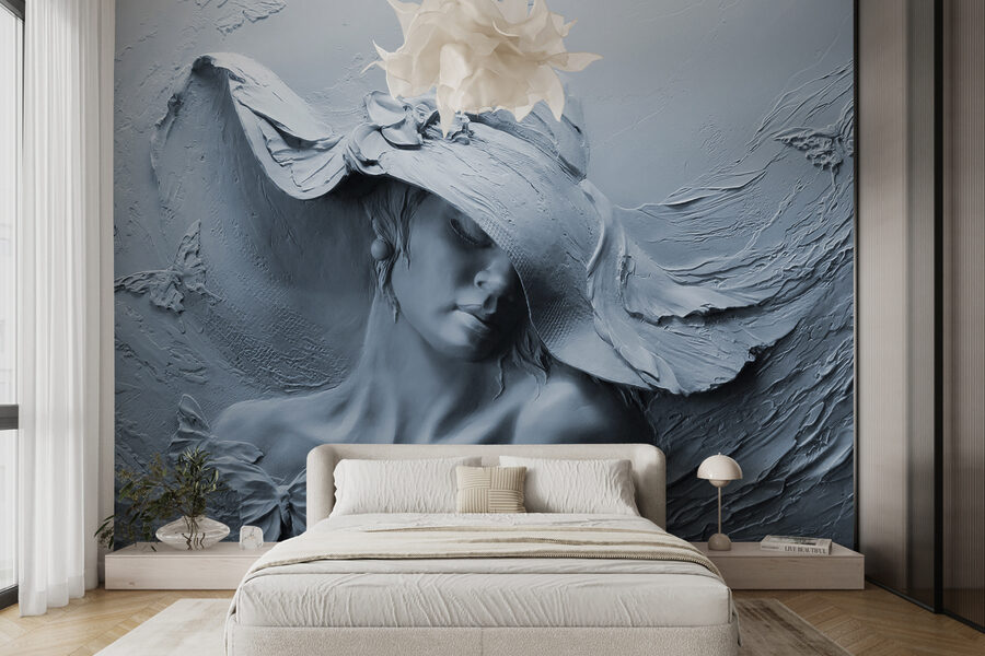 Una scultura di donna con cappello