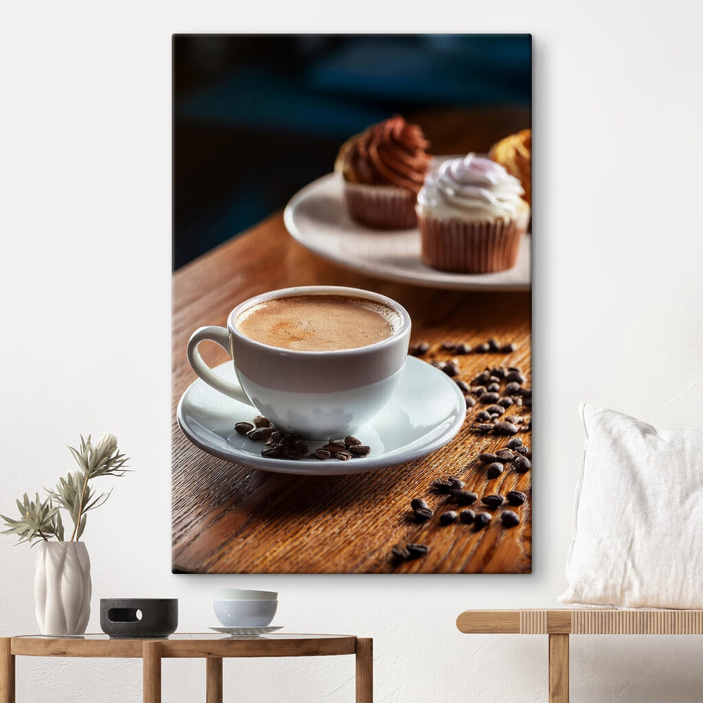 Cup of coffee and cupcakes on a table Cup of coffee and cupcakes on a table