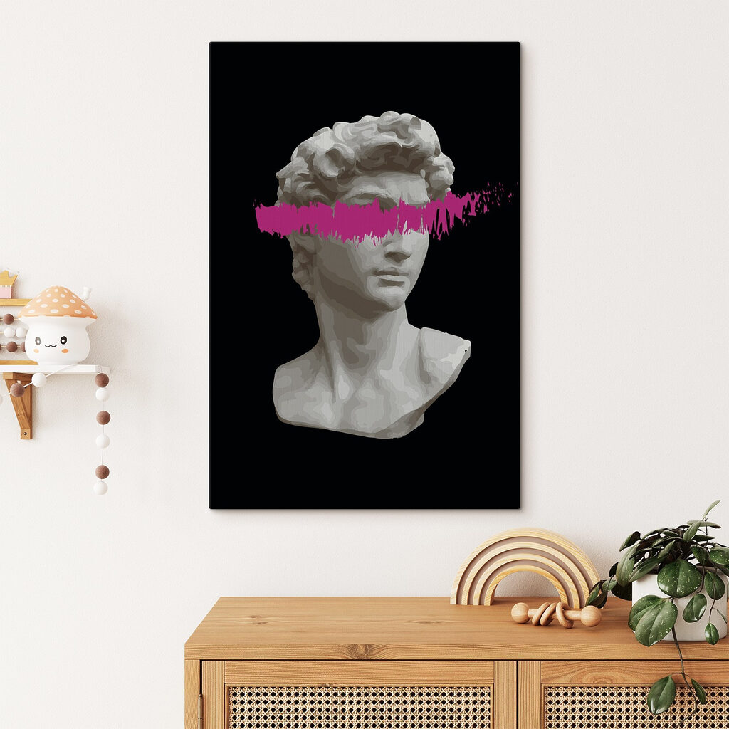 A statue of a man with a pink line