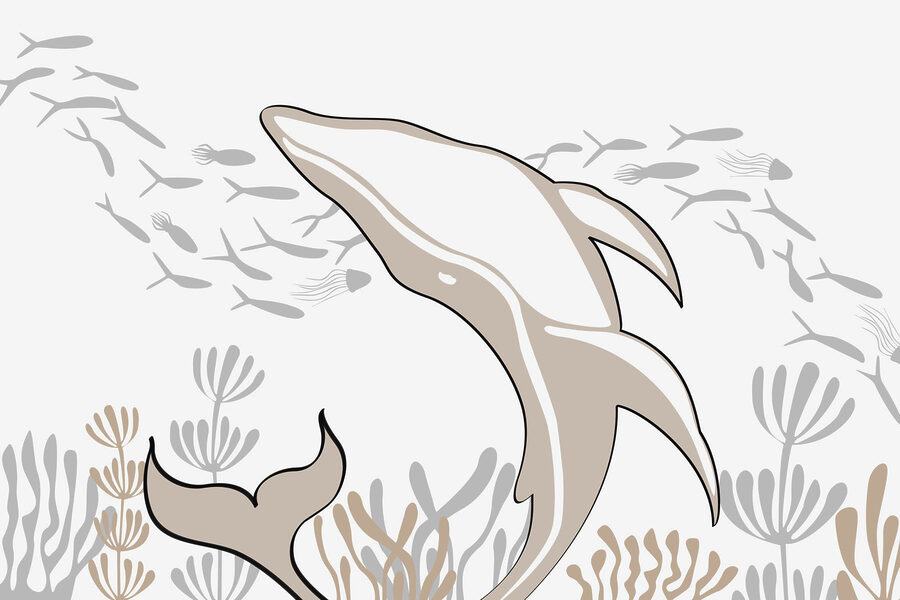 Delfino che nuota nell'oceano