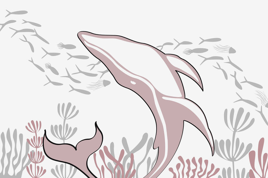 Delfino che nuota nell'oceano