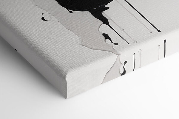 Black and white paint splattered on a white surface