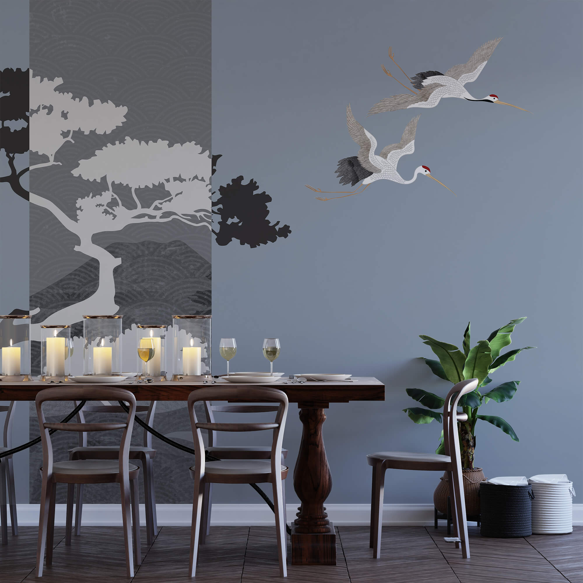 Coppia di gru in volo accanto a un albero