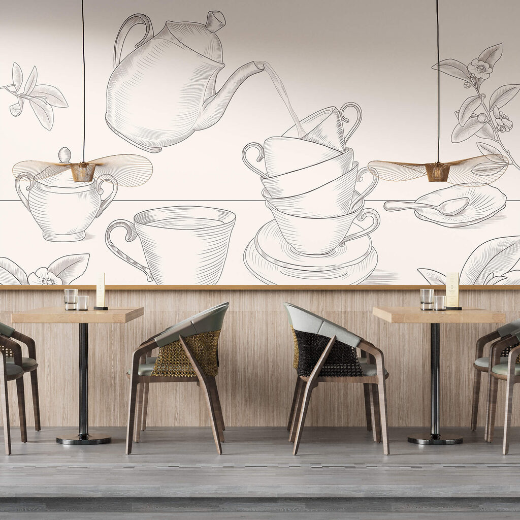 Teiera che versa il tè in una pila di tazze da tè