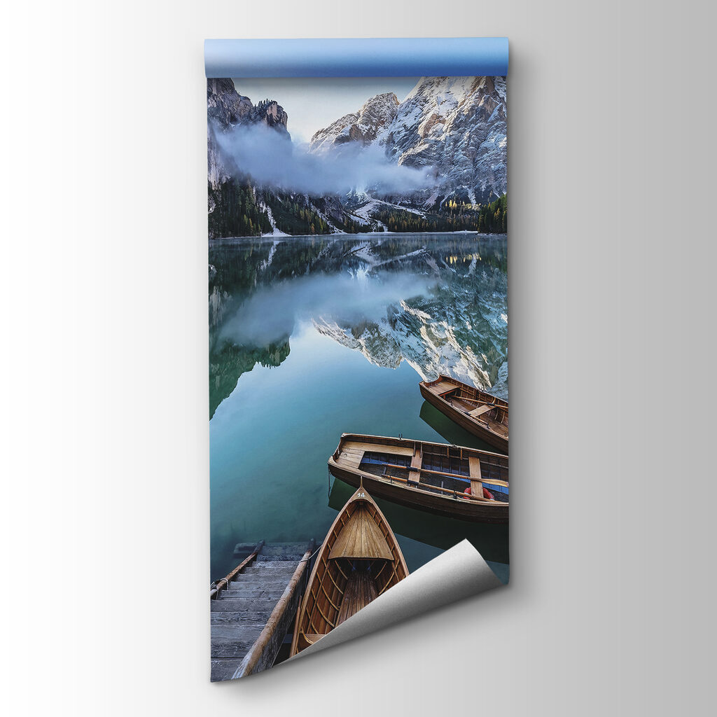 Boats on a lake with mountains in the background Boats on a lake with mountains in the background