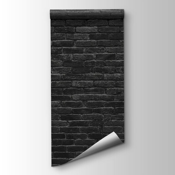 Black brick wall with a white spot Black brick wall with a white spot