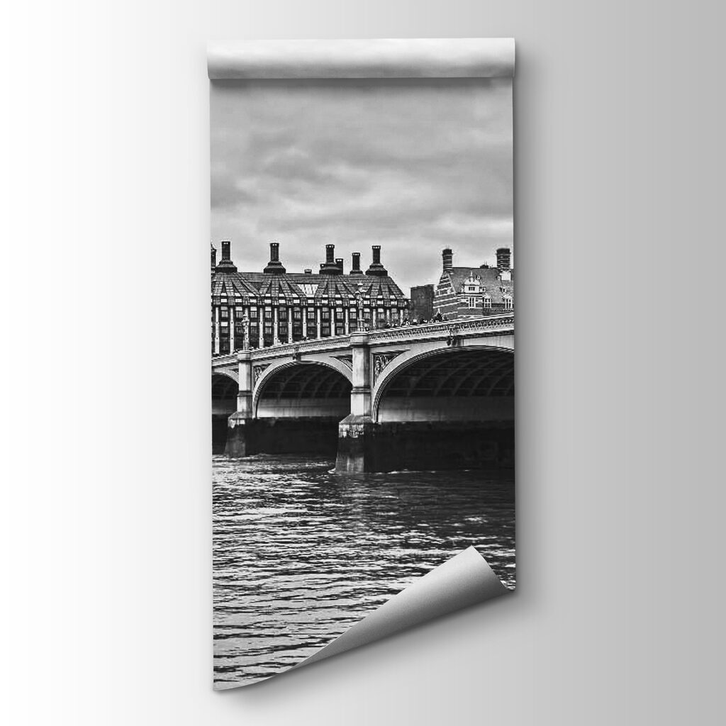 Bridge over water with a clock tower and a red bus
