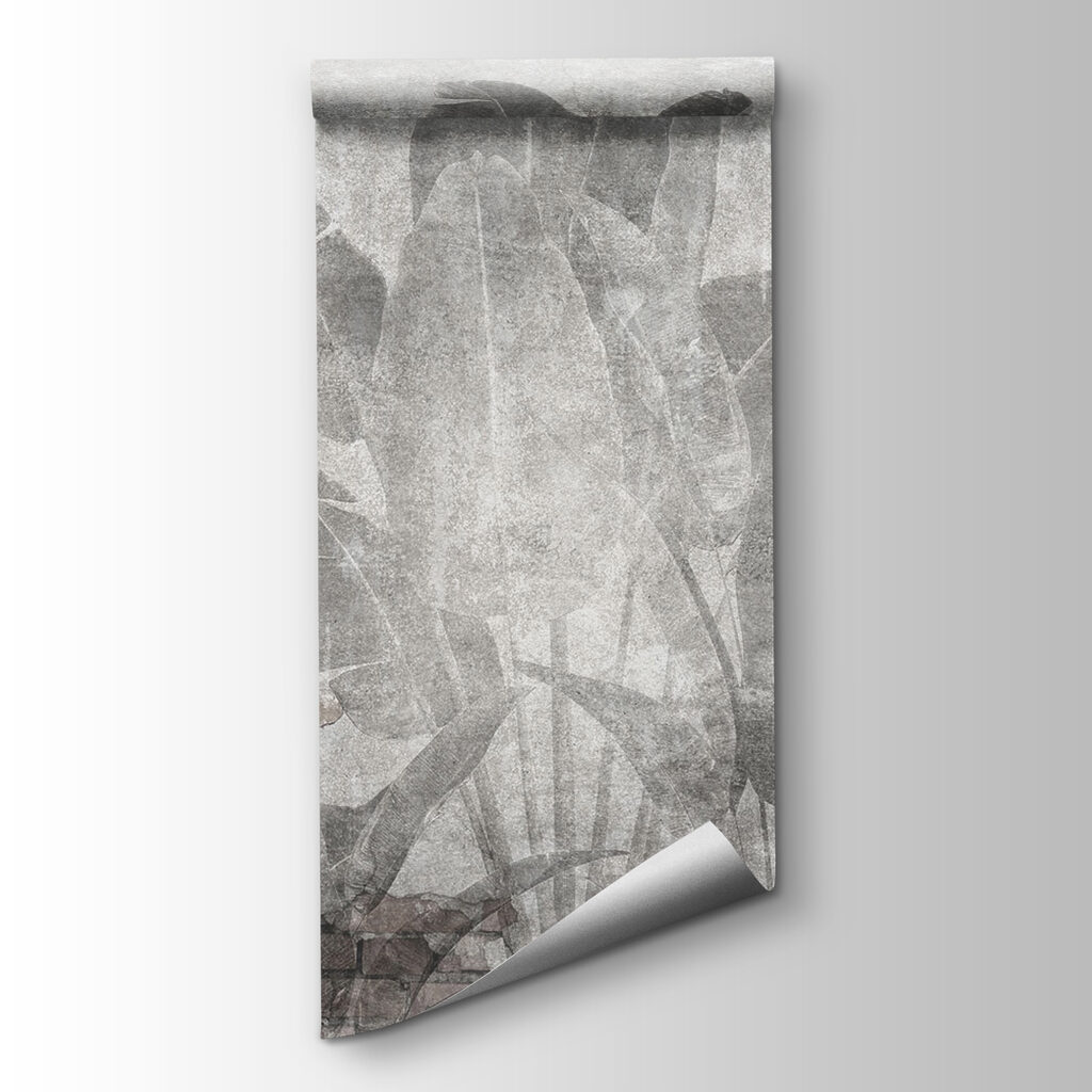 Grey wall with leaves and a brick wall