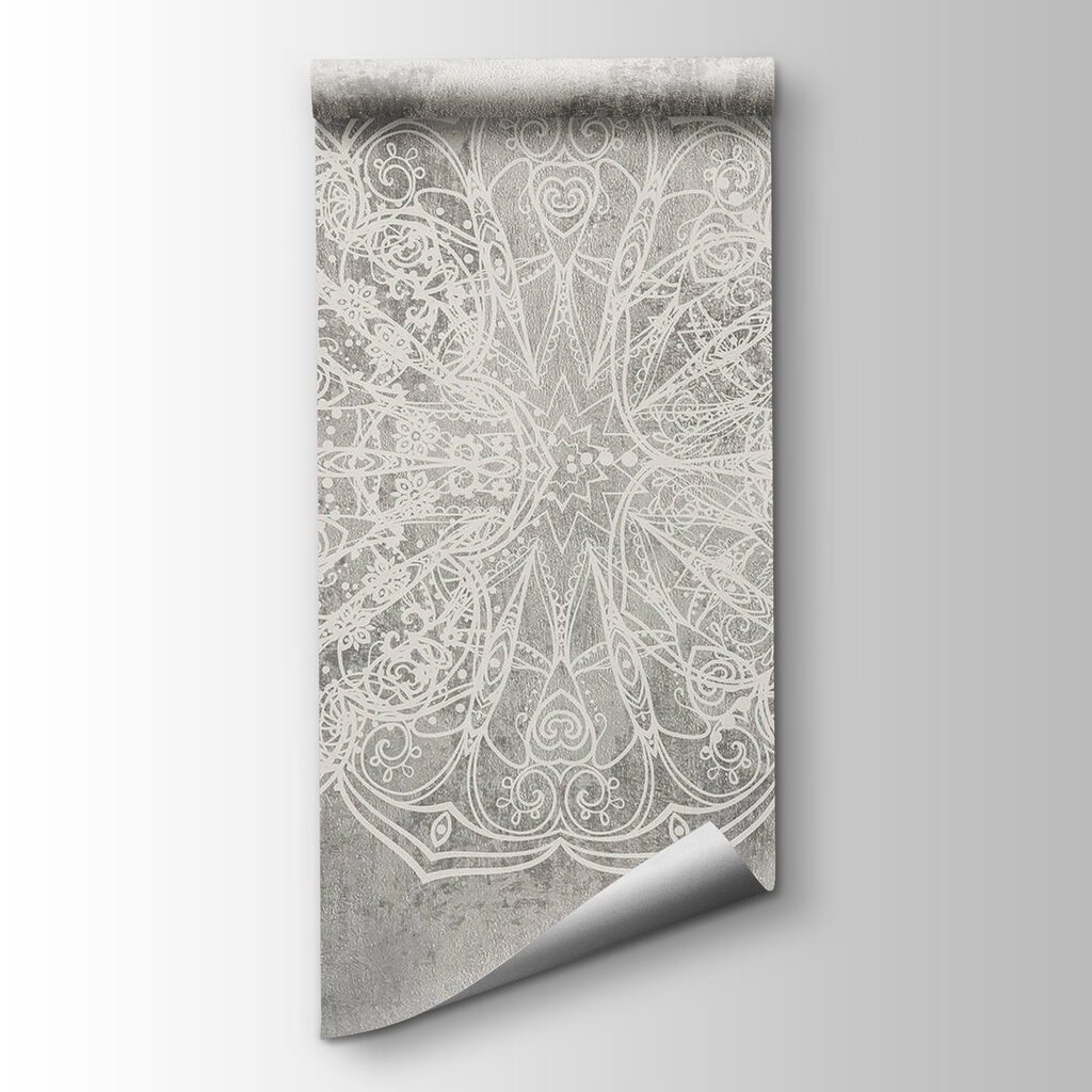 White ornate design on a grey surface White ornate design on a grey surface