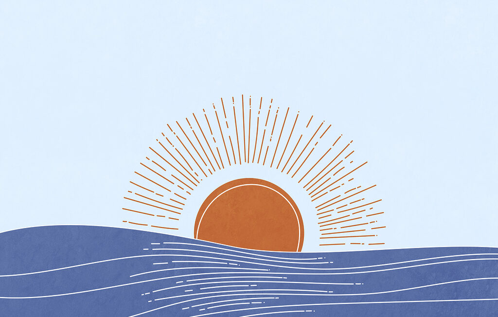 Sun rising over water