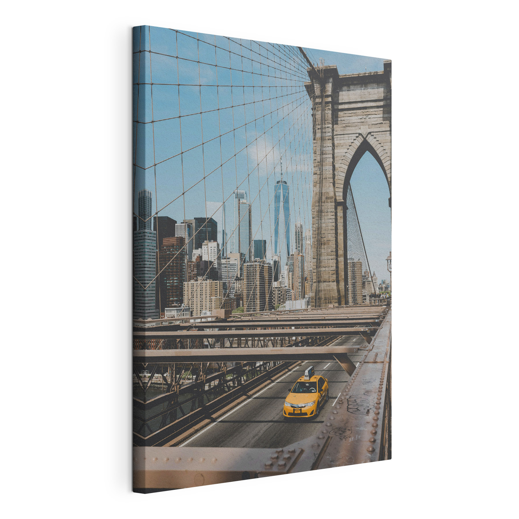 Brooklyn Bridge with a yellow taxi driving down it