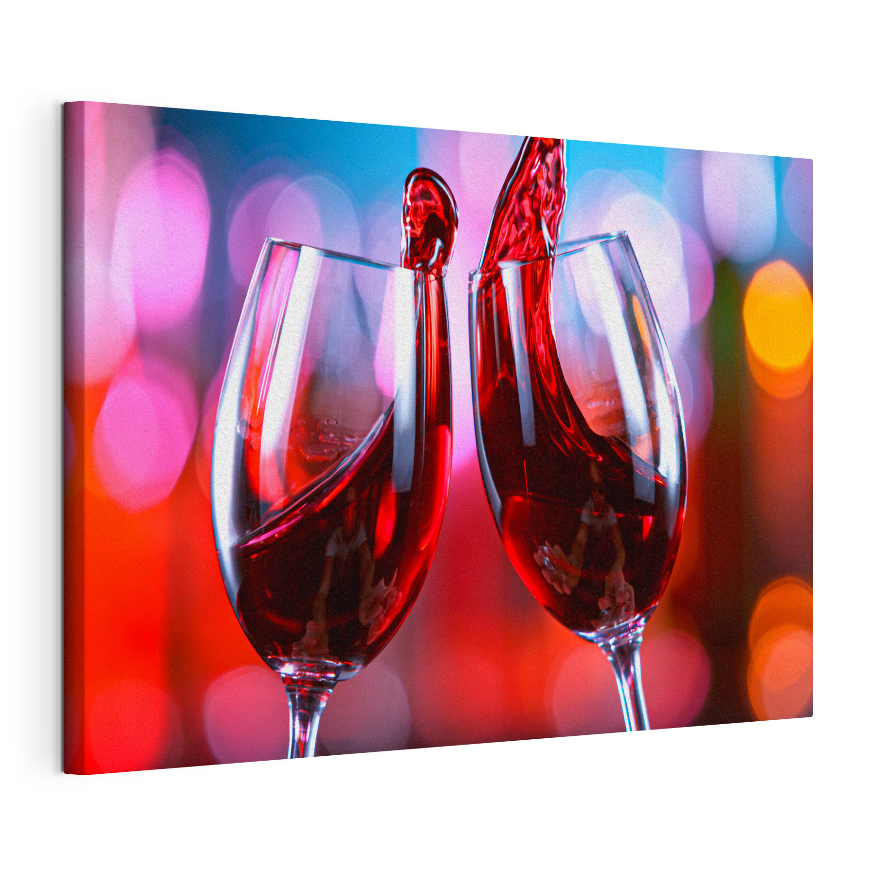 A couple of wine glasses with red liquid pouring into them A couple of wine glasses with red liquid pouring into them