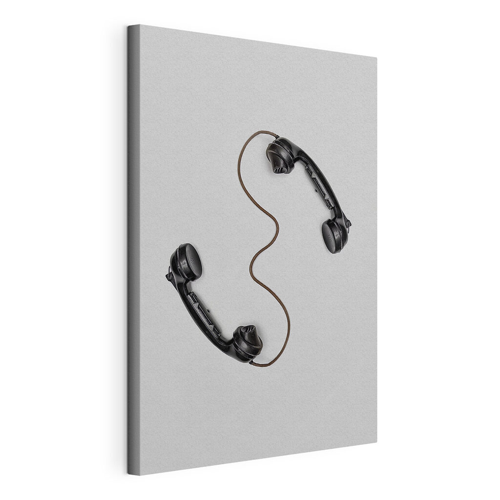 A pair of handsets with a cord A pair of handsets with a cord