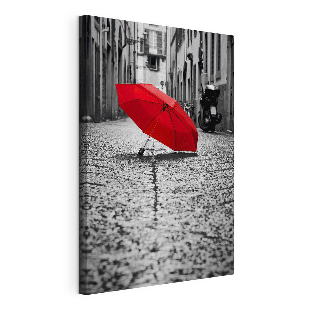 A red umbrella on a street