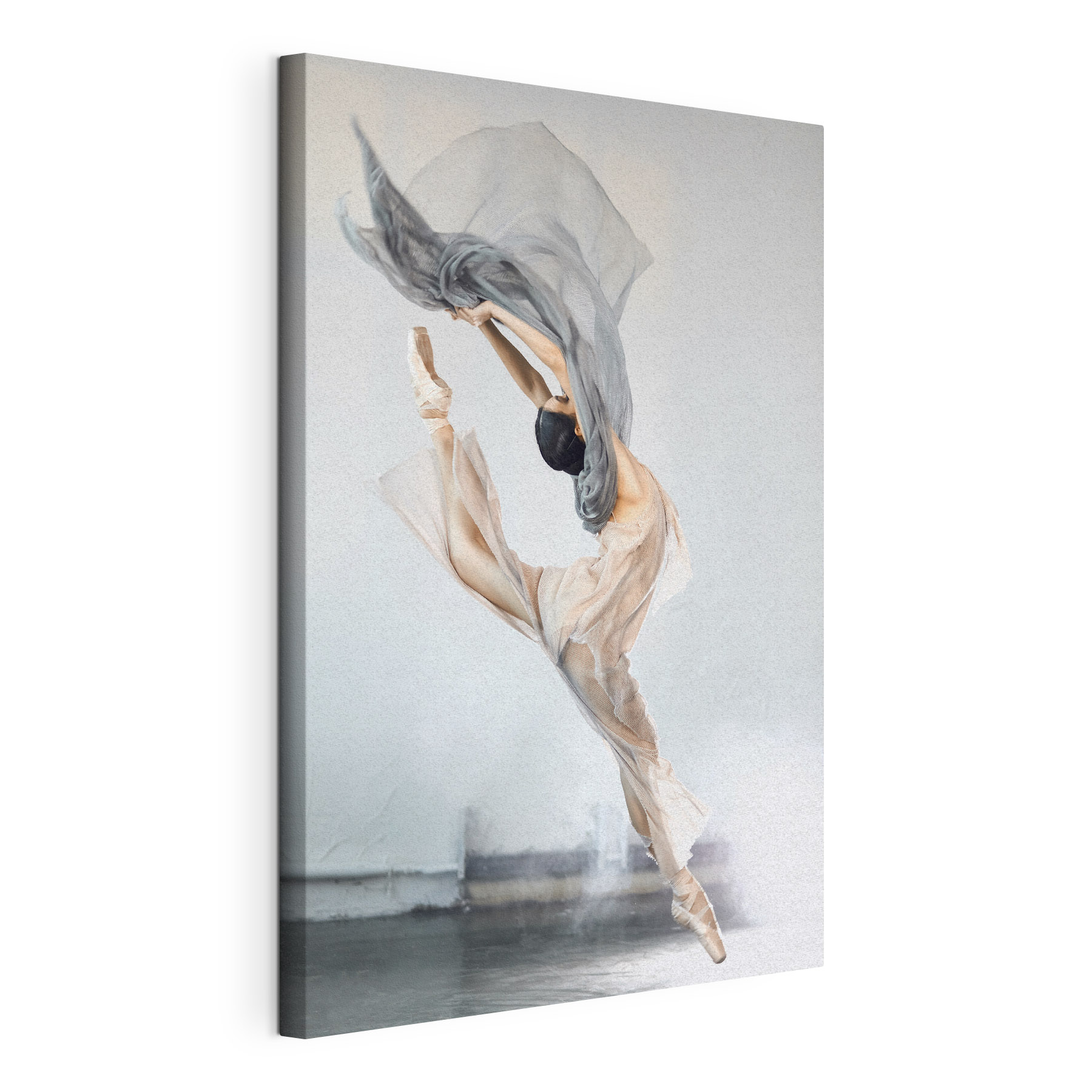 A woman in a dress and pointe shoes jumping in the air