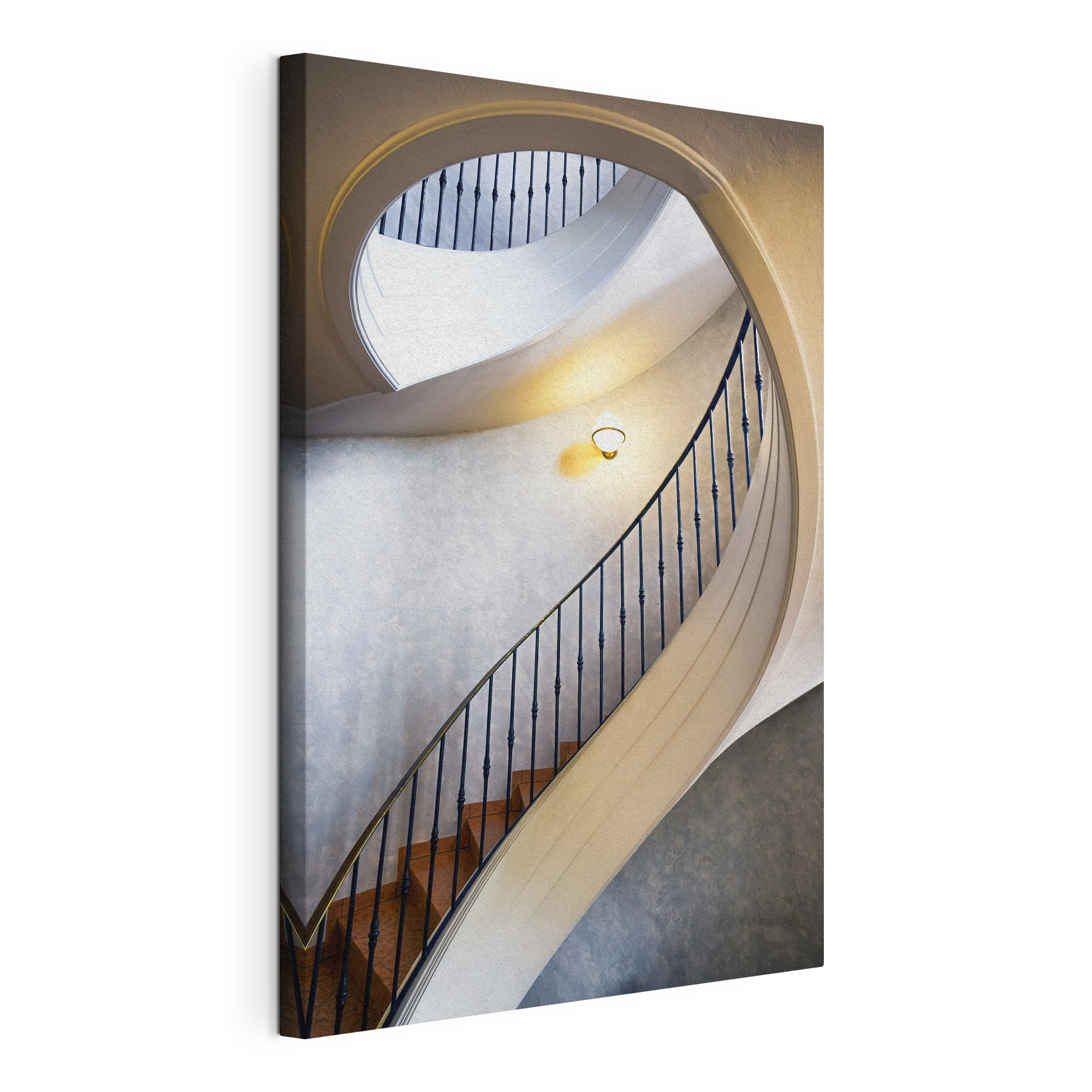 A spiral staircase with a black railing
