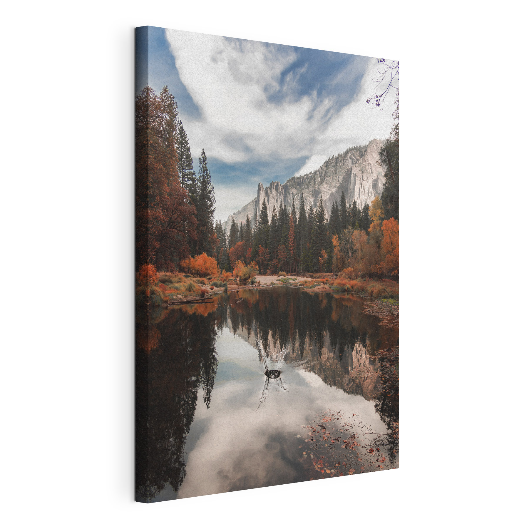A lake surrounded by trees and mountains