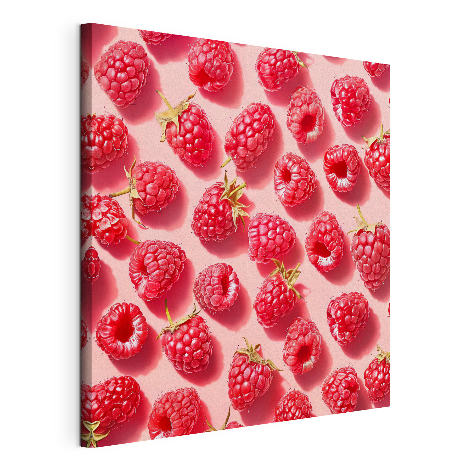 A group of raspberries on a pink surface