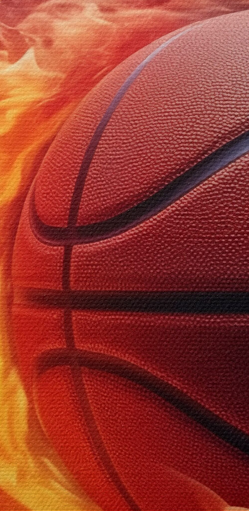 Basketball in flames on a black background Basketball in flames on a black background