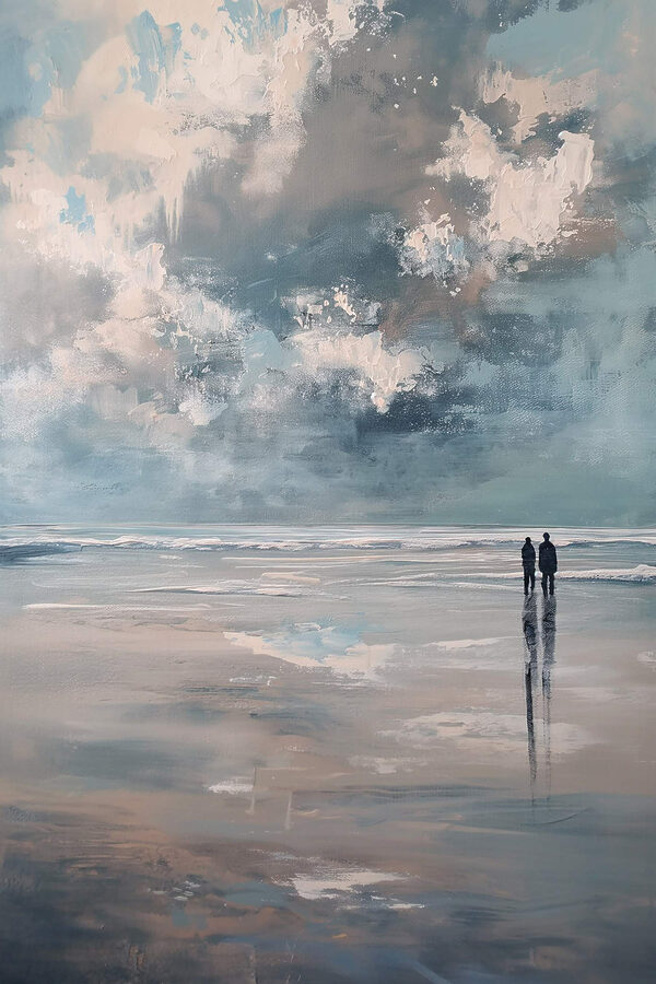 Two people standing on a beach