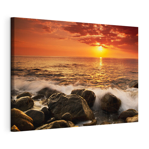 Un tramonto su una spiaggia rocciosa Quadri Un tramonto su una spiaggia rocciosa