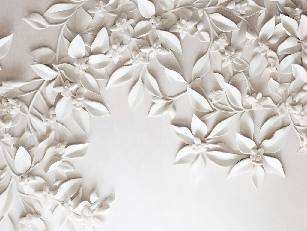 White wall with white flowers and leaves White wall with white flowers and leaves