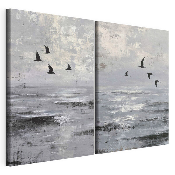 Group of birds flying over water
