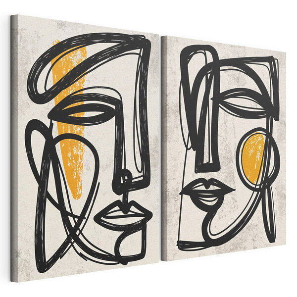 Couple of faces drawn in black and yellow Couple of faces drawn in black and yellow